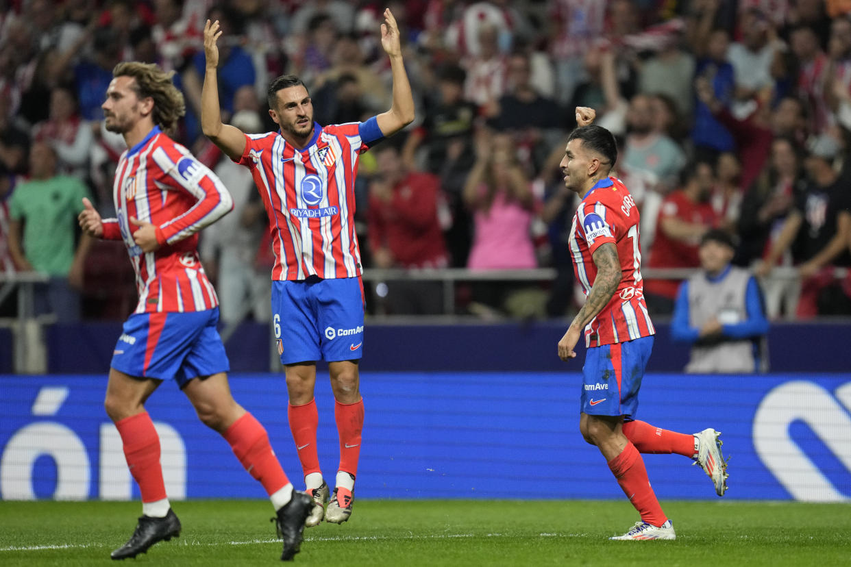 Atletico players celebrate a goal during the La Liga soccer match between Atletico Madrid and Real Madrid at the Metropolitano stadium in Madrid, Spain, Sunday, Sept. 29, 2024. (AP Photo/Bernat Armangue)