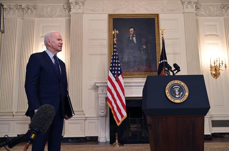 US President Joe Biden answers a reporter's question after speaking about passage of the American Rescue Plan in the State Dining Room of the White House in Washington, DC, on March 6, 2021. - The US Senate approved the $1.9 trillion rescue package that Biden vows will revive the country's pandemic-stricken economy. Passed by 50 votes to 49 in a party line vote, the sweeping legislation now heads back to the Democratic-majority House of Representatives, where it is expected to be adopted barring a last-minute setback. (Photo by SAUL LOEB / AFP) (Photo by SAUL LOEB/AFP via Getty Images)