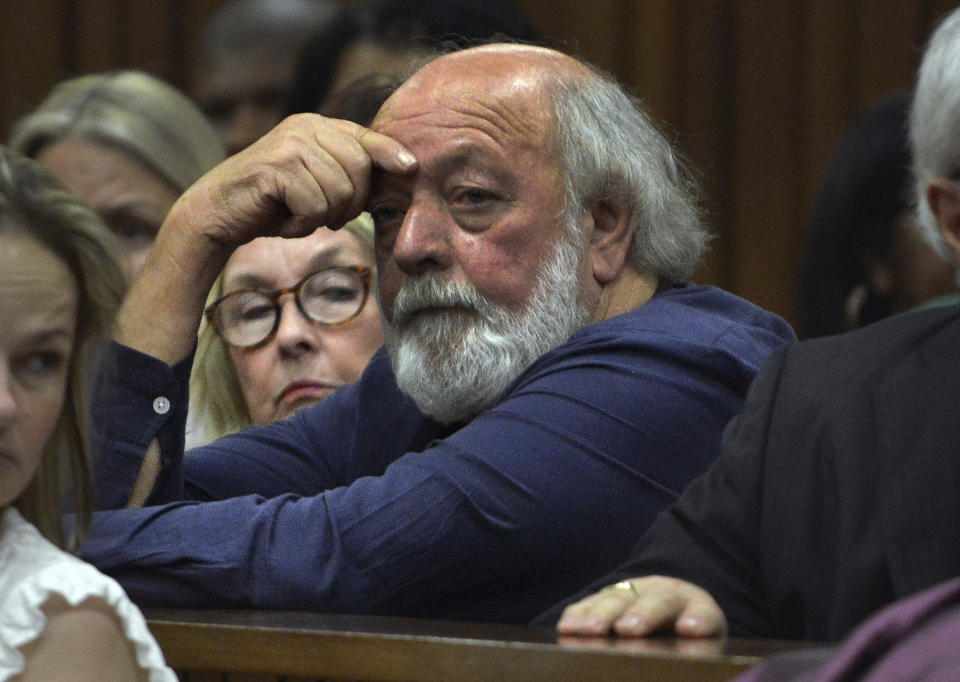 FILE — Parents of the late Reeva Steenkamp, June, left, and Barry right, Steenkamp, right attend court on the third day of mitigation of sentencing for Olympic runner Oscar Pistorius at the high court in Pretoria, South Africa, Wednesday, Oct. 15, 2014. Eight years after he shot dead his girlfriend, Pistorius is up for parole, but first he must meet with her parents as part of the parole procedure. A parole hearing for Pistorius was scheduled for last month and then canceled, partly because a meeting between Pistorius and Steenkamp's parents, Barry and June, had not been arranged, lawyers for both parties told The Associated Press on Monday, Nov. 8, 2021. (AP Photo/Antione de Ras. Pool)