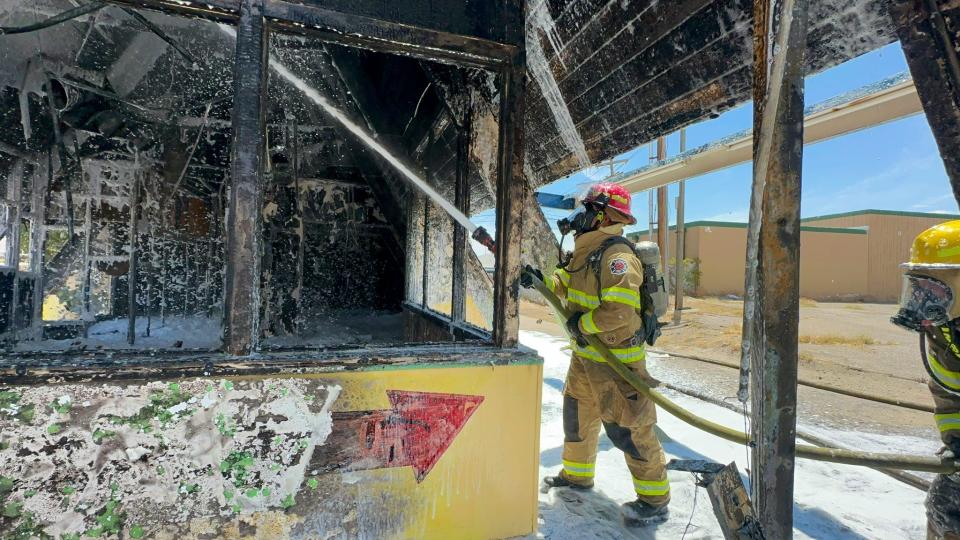 El Paso firefighters extinguish an arson fire that gutted the vacant A-frame building, which was formerly the House of Taste restaurant, on Tetons Drive in Northeast El Paso.