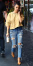 <p>The reality star took frayed jeans to the next level with this ultra-ripped pair (shop a similar style <a rel="nofollow noopener" href="http://shop.nordstrom.com/s/sp-black-ripped-knee-skinny-jeans/4614585" target="_blank" data-ylk="slk:here;elm:context_link;itc:0;sec:content-canvas" class="link ">here</a>) while out for lunch with her little sister Kim in Studio City, Calif. She paired the denim with a cropped mustard-color sweatshirt, pointy pumps, and a sleek pony.</p>