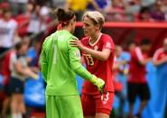Jun 27, 2015; Vancouver, British Columbia, CAN; Canada goalkeeper Erin McLeod (1) reacts with midfielder Sophie Schmidt (13) after losing to England in the quarterfinals of the FIFA 2015 Women's World Cup at BC Place Stadium. England won 2-1. Mandatory Credit: Anne-Marie Sorvin-USA TODAY Sports