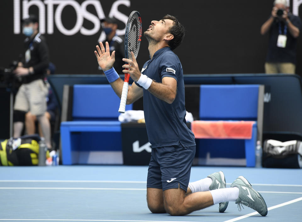 Croatia's Ivan Dodig celebrates after he and partner Slovakia's Filip Polasek defeated Rajeev Ram of the US and Britain's Joe Salisbury in the men's doubles final at the Australian Open tennis championship in Melbourne, Australia, Sunday, Feb. 21, 2021.(AP Photo/Andy Brownbill)