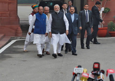 Prime Minister Narendra Modi walks to speak with the media after arriving at the Parliament on the first day of the winter session in New Delhi, India, December 11, 2018. REUTERS/Adnan Abidi