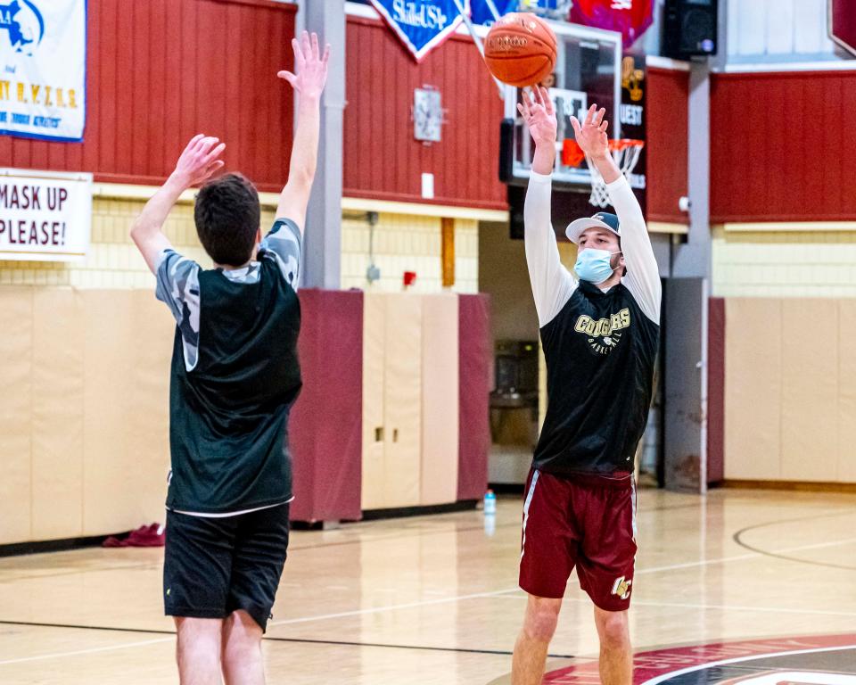 Old Colony assistant coach Jake Jason hits the three.