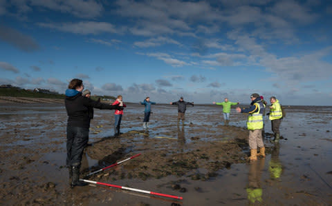 Volunteers showing the outline of the newly discovered Tankerton wreck near Whitstable, North Kent. - Credit: Chris Redgrave /Historic England
