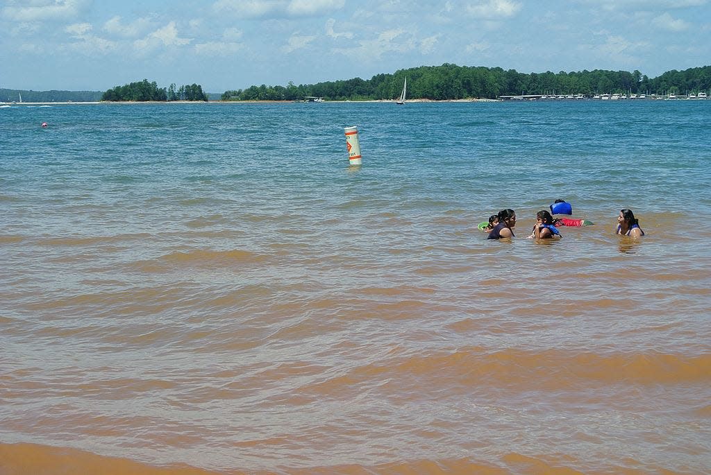 Lake Lanier visitors take a dip on July 22, 2012. Weeks earlier, 11-year-old Kile Glover, Usher's former stepson, was fatally injured at the lake.
