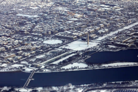 Snow from Winter Storm Gia is seen over the National Mall in Washington as the partial government shutdown becomes the longest in U.S. history in Washington, U.S., January 13, 2019. REUTERS/Carlos Barria