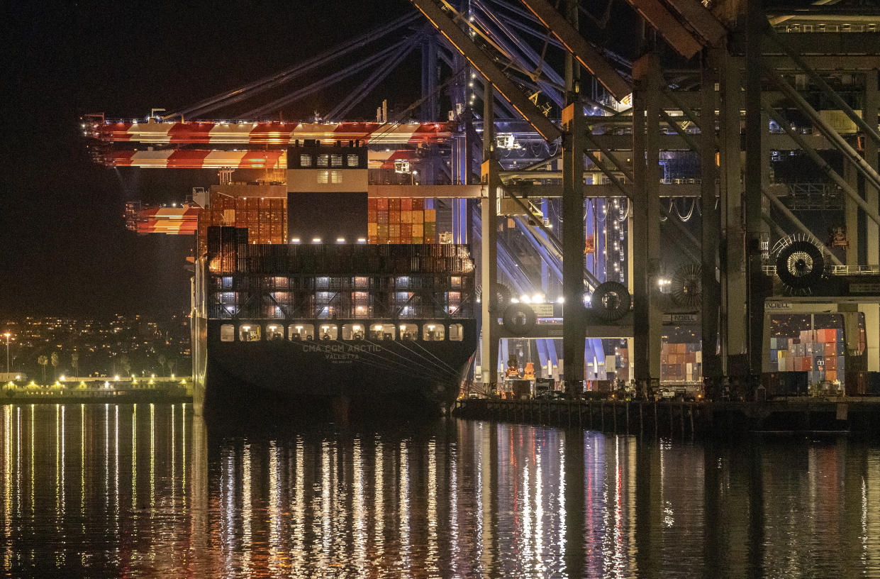 FILE - The Container ship Cam Cgm Arctic (MT) is moored at Maersk APM Terminals Pacific, Pier 400, at the Port of Los Angeles on Monday, Nov. 21, 2022. On Thursday, the Commerce Department issues its first of three estimates of how the U.S. economy performed in the fourth quarter of 2022. (AP Photo/Damian Dovarganes, File)