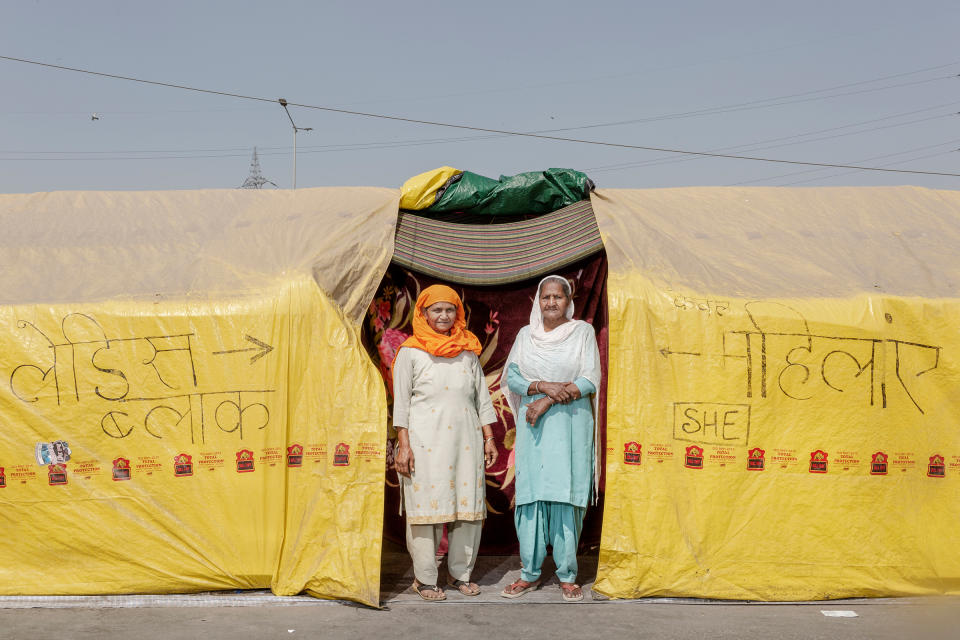 Sarjit Kaur, left, and Dilbeer Kaur, right, from Rampur, Uttar Pradesh, have been at the protests for two months. “We are here to show solidarity and support,” Dilbeer says. Prime Minister Modi is “making us leave our farms and sit here to fight for our rights. We are here to get these laws repealed, and we will be here till we get it done.”<span class="copyright">Kanishka Sonthalia for TIME</span>