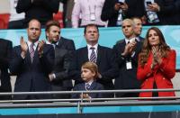 <p>The Duchess of Cambridge attended the England versus Germany soccer match, wearing a <a href="https://go.redirectingat.com?id=74968X1596630&url=https%3A%2F%2Fwww.zara.com%2Fus%2Fen%2Ftextured-double-breasted-blazer-p02410564.html&sref=https%3A%2F%2Fwww.townandcountrymag.com%2Fstyle%2Ffashion-trends%2Fnews%2Fg1633%2Fkate-middleton-fashion%2F" rel="nofollow noopener" target="_blank" data-ylk="slk:red Zara blazer;elm:context_link;itc:0;sec:content-canvas" class="link ">red Zara blazer</a>. Prince William and Prince George joined Kate at Wembley Stadium. </p>