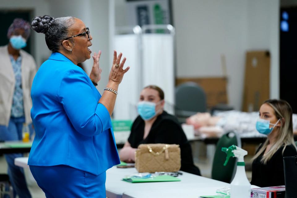 Kimberly Harrington, president of the Phlebotomy Express Training Center in Detroit, introduces herself to a new set of students Monday, Jan. 10, 2022.