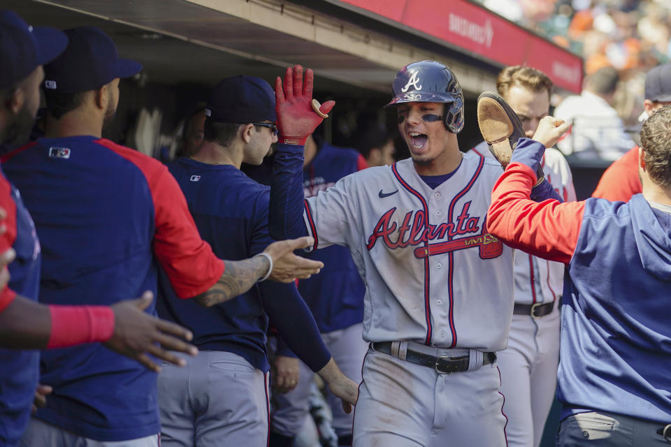 Atlanta Braves' Vaughn Grissom, second from right, celebrates with teammates in the dugout after scoring against the San Francisco Giants on a single Robbie Grossman during the third inning of a baseball game in San Francisco, Wednesday, Sept. 14, 2022. (AP Photo/Godofredo A. Vásquez)