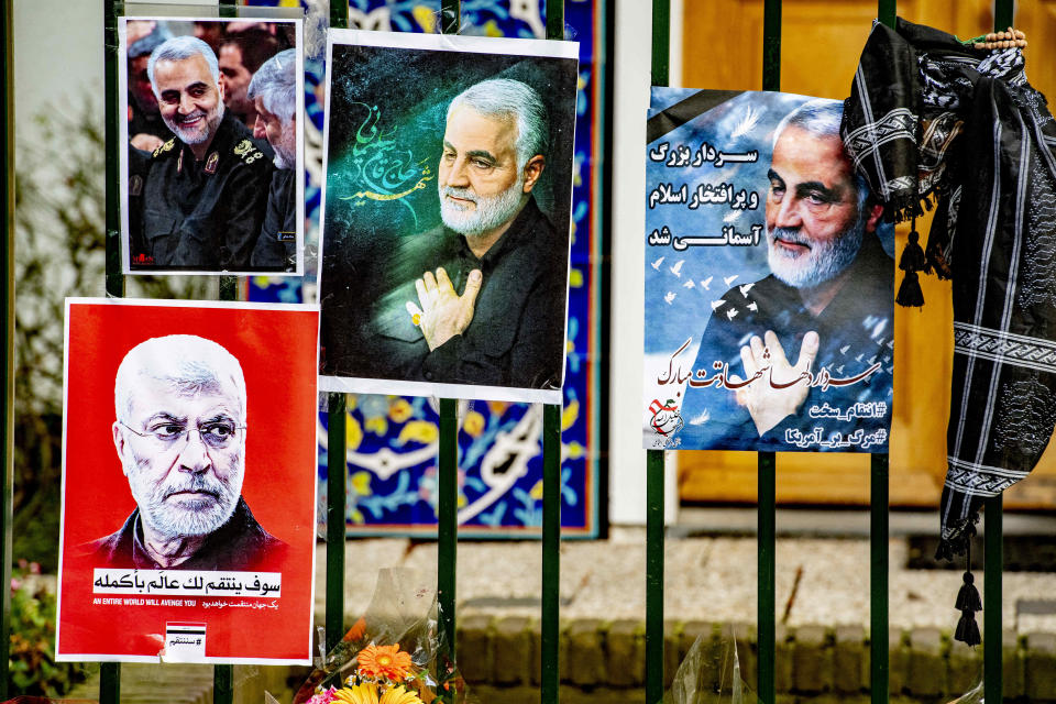 Flowers and posters at the gate of the Iranian embassy in The Hague, Netherlands for Revolutionary Guard General Qassem Soleimani.