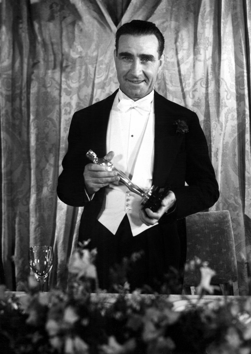 1933: Frank Lloyd [Best Director, CAVALCADE] with his Oscar, 3/19/34