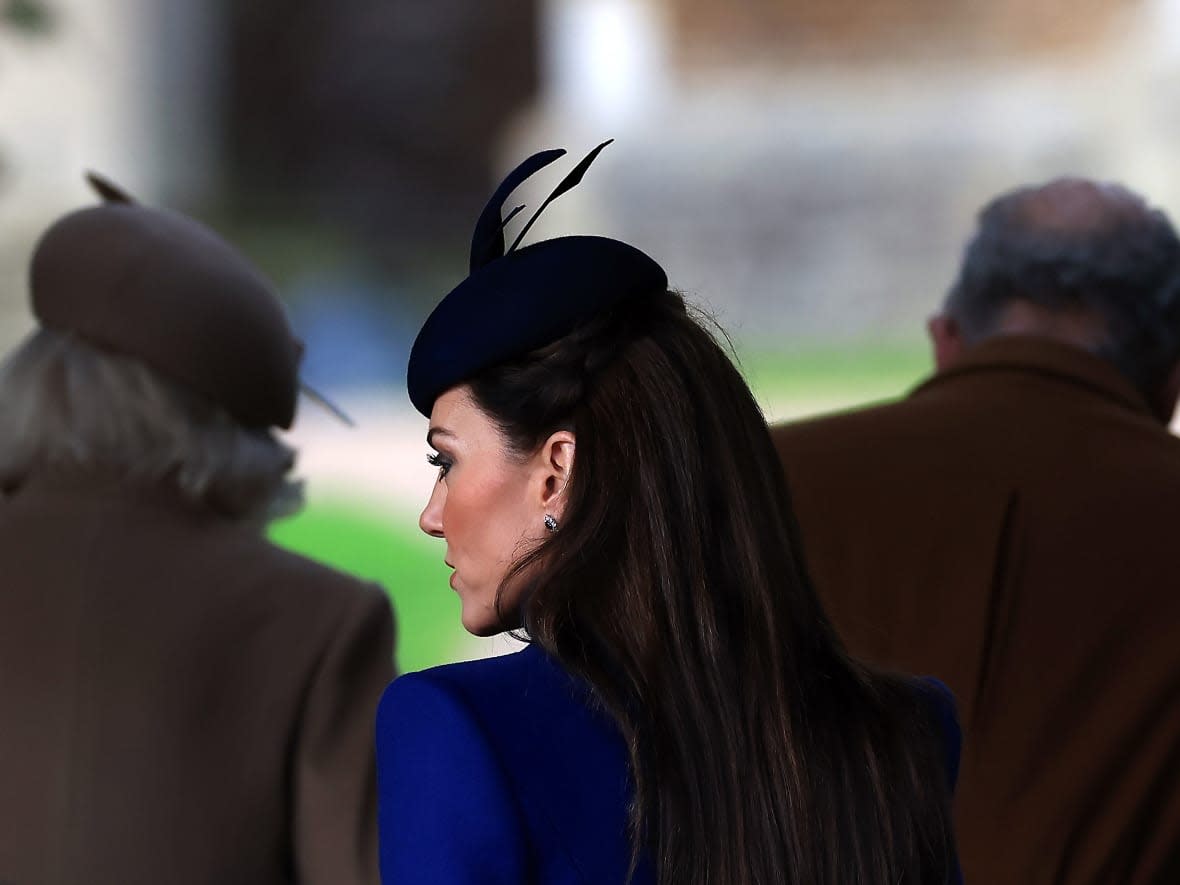 Catherine, Princess of Wales, attends the Christmas Morning Service at Sandringham Church on Dec. 25, 2023 in Sandringham, Norfolk. In the background are King Charles and Queen Camilla. It was Catherine's last public appearance before undergoing abdominal surgery in January.  (Stephen Pond/Getty Images - image credit)