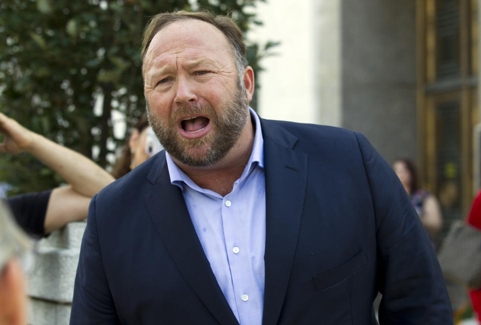 FILE- In this Sept. 5, 2018, file photo conspiracy theorist Alex Jones speaks outside of the Dirksen building of Capitol Hill in Washington. Connecticut’s highest court is set to hear arguments on whether Jones was wrongly penalized for an outburst on his internet show against a lawyer for relatives of Sandy Hook Elementary School shooting victims. The state Supreme Court hearing is scheduled for Thursday, Sept. 26, 2019. Relatives of eight of 20 children and six educators killed in the 2012 shooting in Newtown are suing Jones, his Infowars show and others for defamation for promoting a theory that the shooting was a hoax. (AP Photo/Jose Luis Magana, File)