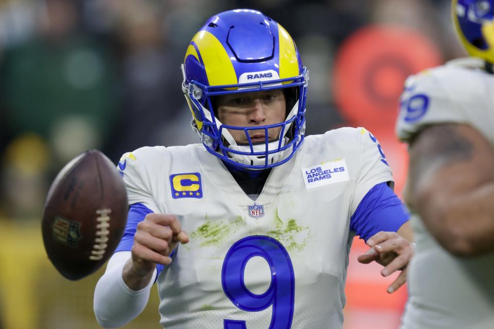 Los Angeles Rams' Matthew Stafford fumbles the ball during the first half of an NFL football game against the Green Bay Packers Sunday, Nov. 28, 2021, in Green Bay, Wis. The Packers recovered the ball. (AP Photo/Matt Ludtke)