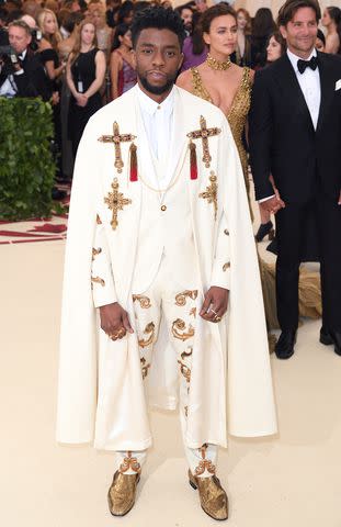 <p>Karwai Tang/Getty</p> Chadwick Boseman wore a caped Versace suit at the 2018 Met Gala