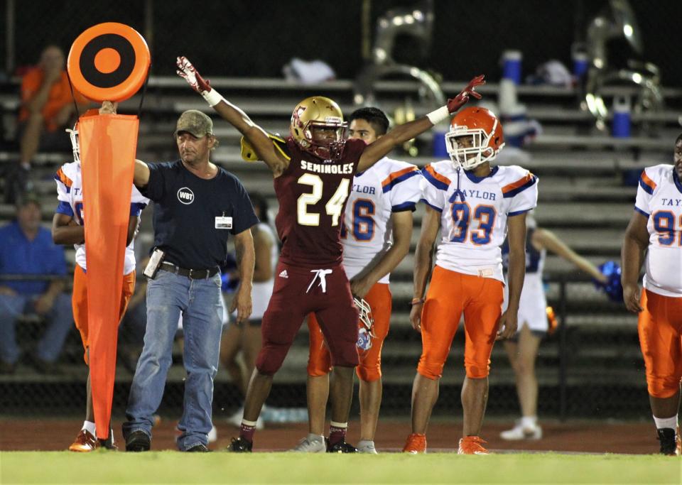 Florida High defensive back Donovan Barnes celebrates a turnover on downs as the Seminoles beat Taylor County 52-12 on Friday, Aug. 30, 2019.