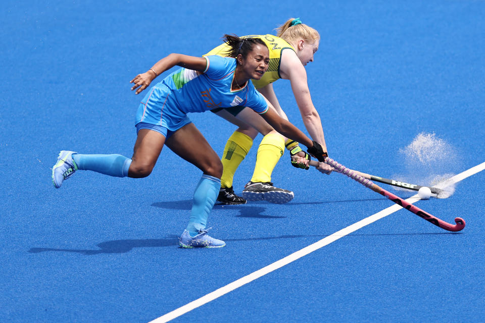 TOKYO, JAPAN - AUGUST 02: Amy Rose Lawton of Team Australia passes the ball against Chanu Pukhrambam Sushila of Team India during the Women's Quarterfinal match between Australia and India on day ten of the Tokyo 2020 Olympic Games at Oi Hockey Stadium on August 02, 2021 in Tokyo, Japan. (Photo by Buda Mendes/Getty Images)