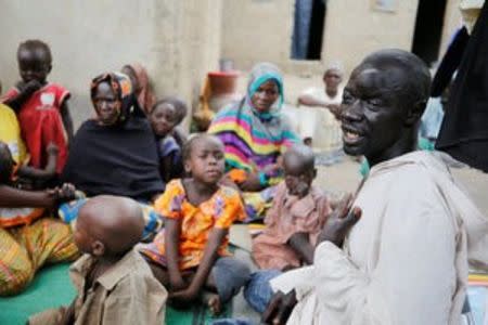 Bukar Abdilkadir with his eight children, two wivies, mother and octogenarian father seen after two weeks on arrival at the IDP camp at Banki, Borno, Nigeria April 26, 2017. REUTERS/Afolabi Sotunde