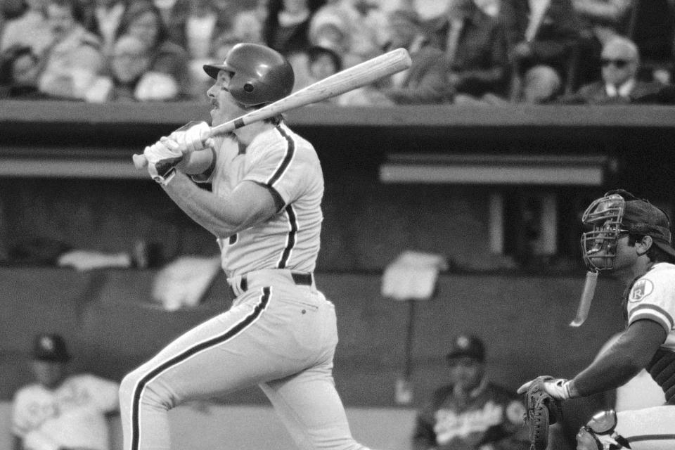 FILE - In this Oct. 19, 1980, file photo, Philadelphia Phillies' Mike Schmidt watches his two-run homer in the fourth inning as Kansas City Royals catcher Darrell Porter watches, at right, during Game 5 of the World Series in Kansas City. (AP Photo/Stubblebine, File)