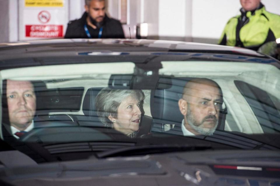 Theresa May pictured leaving the LBC radio studio this morning