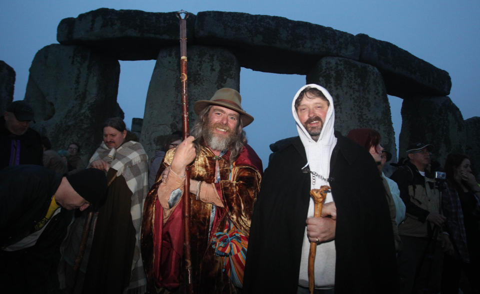 Crowds gather at dawn amongst the stones at Stonehenge in Wiltshire for the Summer Solstice.