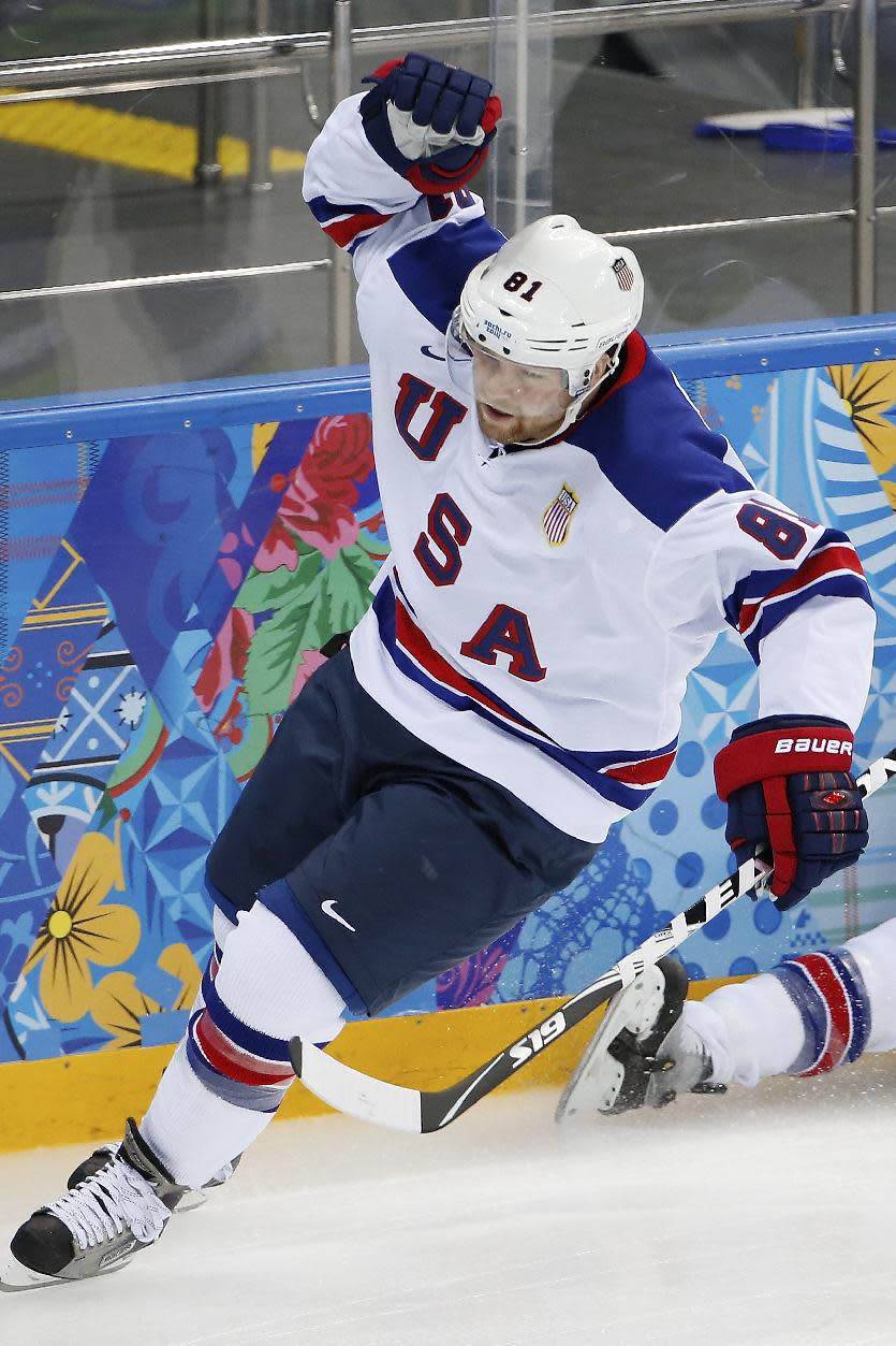 USA forward Phil Kessel celebrates his goal against Slovenia during the 2014 Winter Olympics men's ice hockey game at Shayba Arena Sunday, Feb. 16, 2014, in Sochi, Russia. (AP Photo/Petr David Josek)