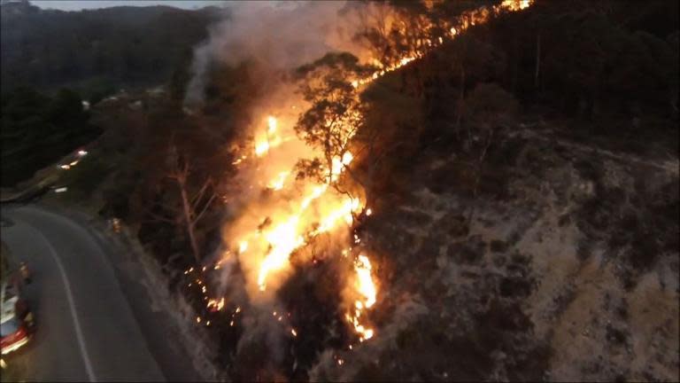 Footage shot from an unmanned drone above Lithgow, Australia, shows a railway fire, Oct. 2013. (AFP)