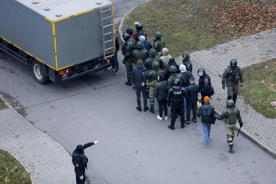 Belarusian police detain demonstrators during an opposition rally to protest the official presidential election results in Minsk, Belarus, Sunday, Nov. 15, 2020. A Belarusian human rights group says more than 500 people have been arrested in protests around the country calling for authoritarian President Alexander Lukashenko to step down. The Sunday demonstrations continued to wave of near-daily protests that have gripped Belarus since early August. (AP Photo)