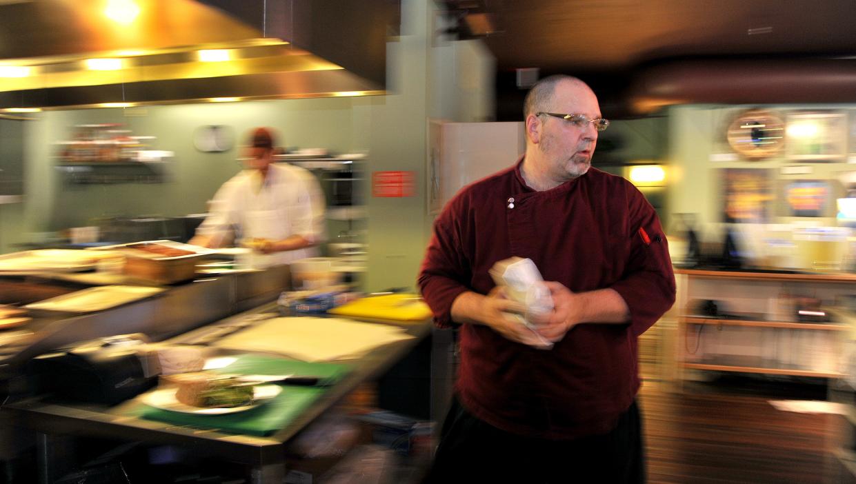 Greg DeSanto, the chef and owner of Olio, is shown in the restaurant's kitchen in July 2013.