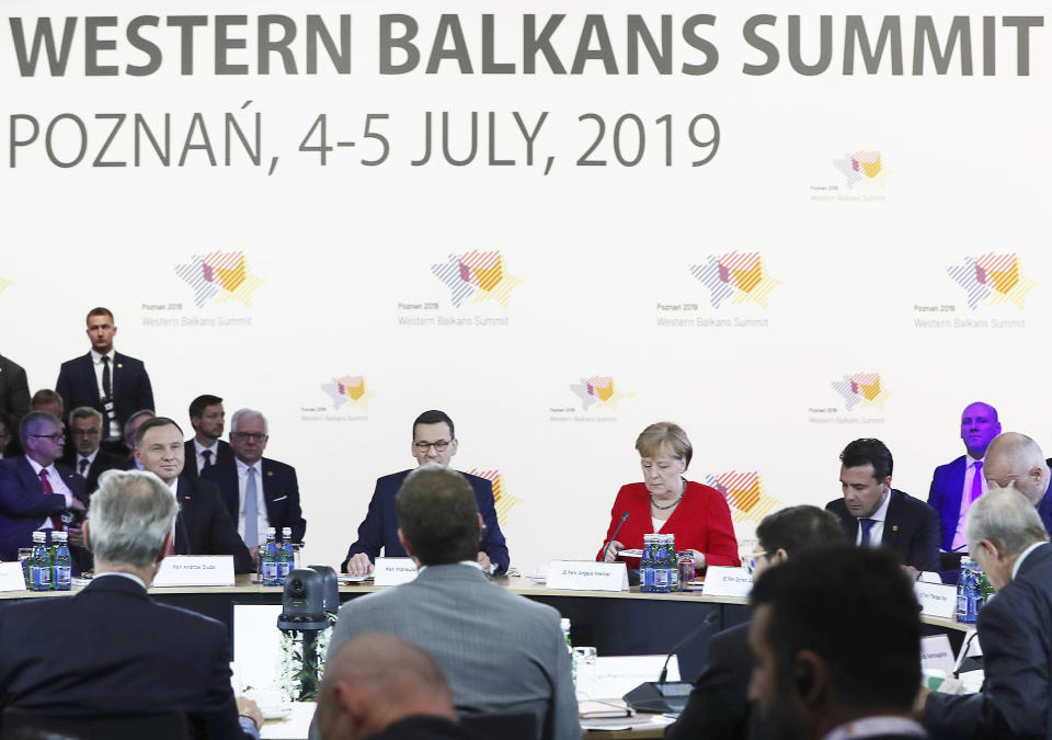 German Chancellor Angela Merkel,second right, and Poland's Prime Minister Mateusz Morawiecki listening to a speech by Poland's President Andrzej Duda,left, during a summit meeting that aims to reassure Western Balkan states that their aspirations to join the European Union have backing among EU leaders, in Poznan, Poland, Friday, July 5, 2019.(AP Photo/Czarek Sokolowski)