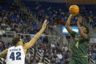 Colorado State guard Isaiah Stevens (4) shoots over Nevada forward K.J. Hymes (42) during the first half of an NCAA college basketball game, Wednesday, Jan. 24, 2024 in Reno, Nev. (AP Photo/Tom R. Smedes)