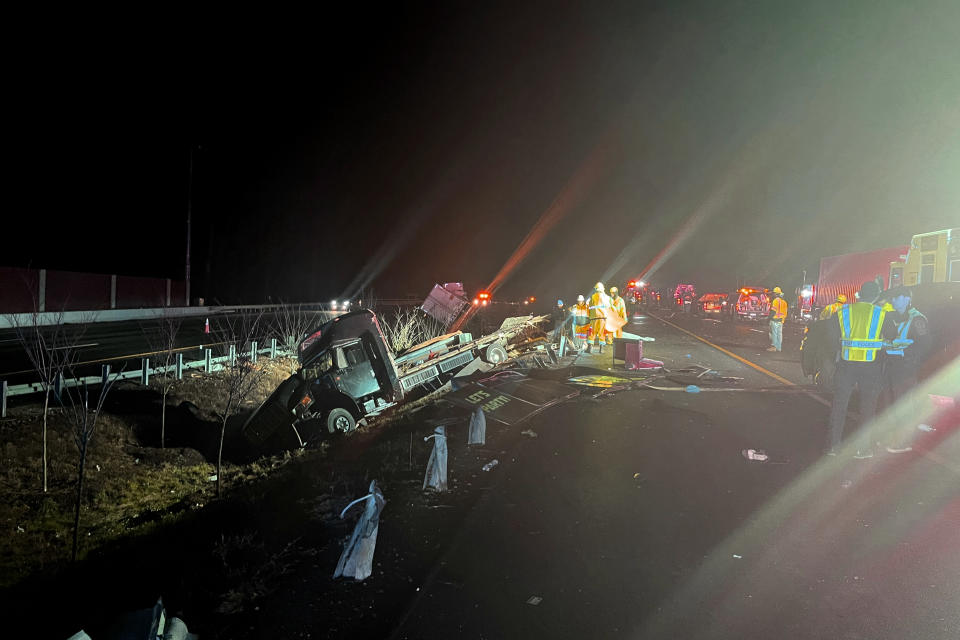 This photo from Virginia State Police shows emergency personnel at the scene of a crash on Interstate 64 in in York County Virginia early Friday, Dec. 16, 2022. The crash occurred just after 1:30 a.m. near Williamsburg, which is located between Richmond and Norfolk. (Virginia State Police via AP)