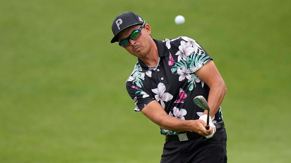 Rickie Fowler, chipping onto the fifth green, was able to upset No. 2-seeded Jon Rahm in Wednesday's opening round of the WGC-Dell Technologies Match Play tournament by winning the pivotal 12th hole to break a tie.