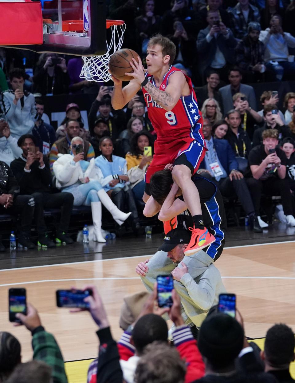 Philadelphia 76ers guard Mac McClung (9) competes in the Dunk Contest.