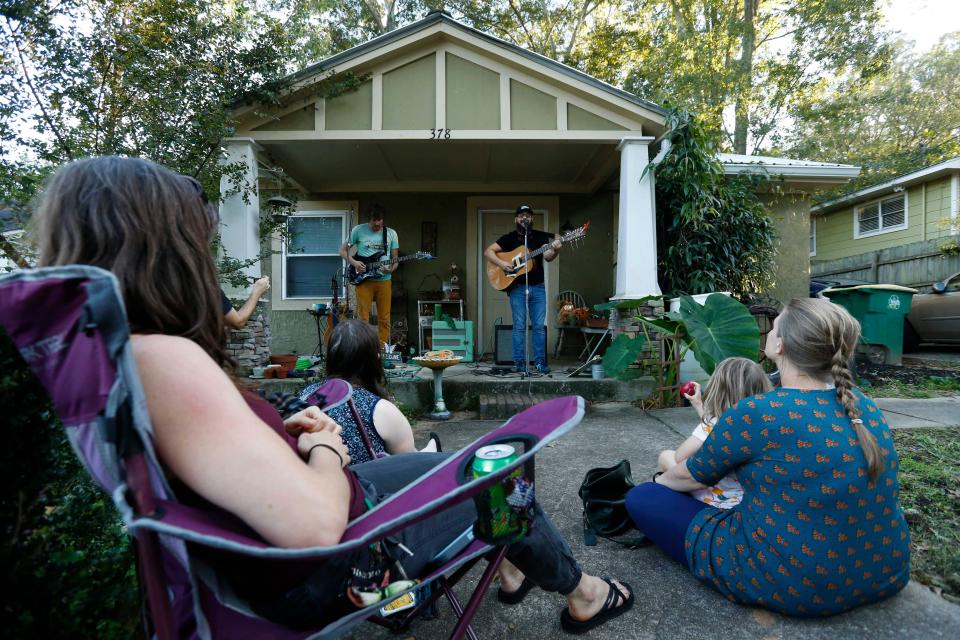 FILE - Athens-Clarke commissioners Jesse Houle and Tim Denson perform at Historic Athens Porchfest in Athens, Georgia on Sunday, Oct. 10, 2021.