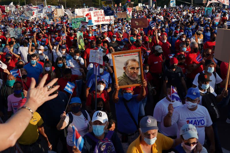 People parade during May Da in Havana