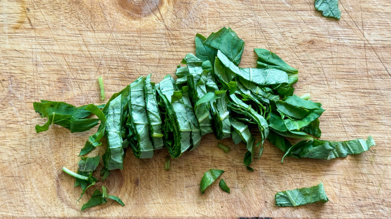 sliced basil on board