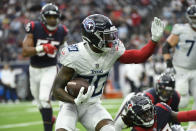Tennessee Titans wide receiver Chester Rogers (80) runs against the Houston Texans after a catch during the first half of an NFL football game, Sunday, Jan. 9, 2022, in Houston. (AP Photo/Justin Rex )