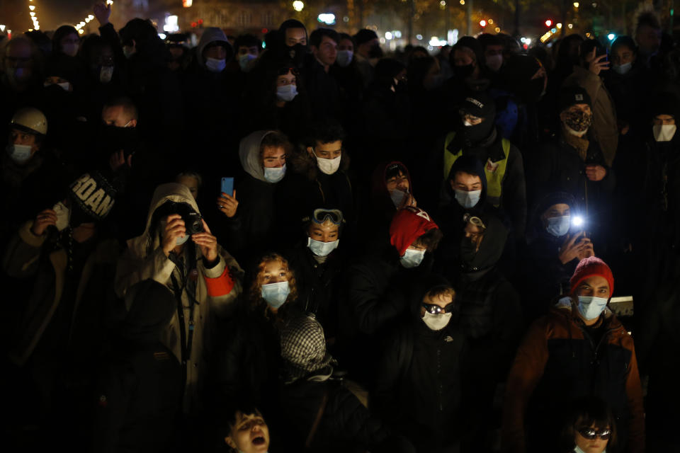 Demonstrators leave after a protest against a proposed security bill, Saturday, Dec.12, 2020 in Paris. The bill's most contested measure could make it more difficult for people to film police officers. It aims to outlaw the publication of images with intent to cause harm to police. The provision has caused such an uproar that the government has decided to rewrite it. Critics fear the law could erode press freedom and make it more difficult to expose police brutality. (AP Photo/Thibault Camus)