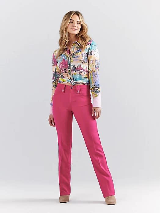 model wearing pink jeans with western graphic top