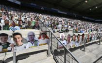 Cardboards with photos of Moenchengladbach fans displayed on the stands prior the German Bundesliga soccer match between Borussia Moenchengladbach and Union Berlin in Moenchengladbach, Germany, Sunday, May 31, 2020. The German Bundesliga becomes the world's first major soccer league to resume after a two-month suspension because of the coronavirus pandemic. (AP Photo/Martin Meissner, Pool)