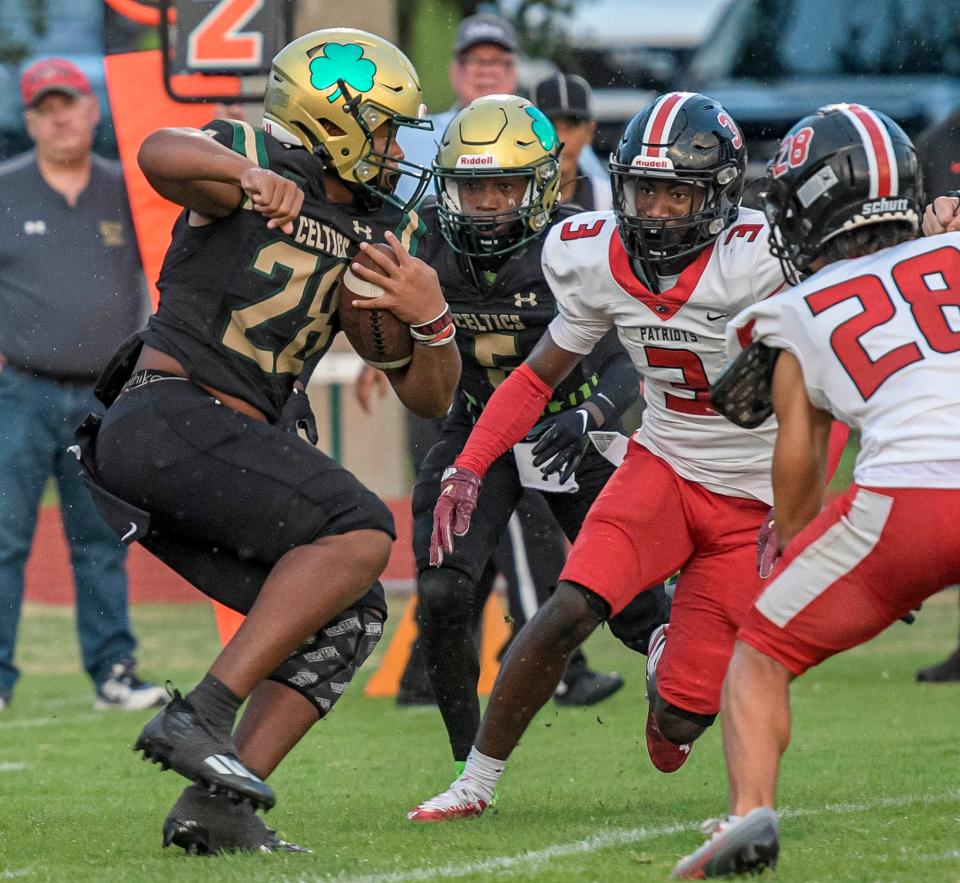 Trinity Catholic's James Pullings (28) carries the ball during a game between Trinity Catholic High School and Tampa Carrollwood Day High School in Ocala on Friday, Sept. 15, 2023. [PAUL RYAN / CORRESPONDENT]