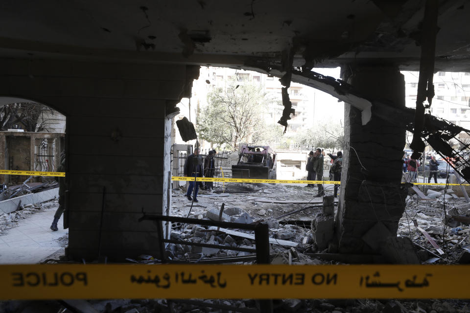 File - People view the damage in a residential neighborhood after an early morning Israeli airstrike in the capital city of Damascus, Syria, Sunday, Feb. 19, 2023. Syrian state news reported that Israeli airstrikes have targeted a residential neighborhood in central Damascus. (AP Photo/Omar Sanadiki, File)