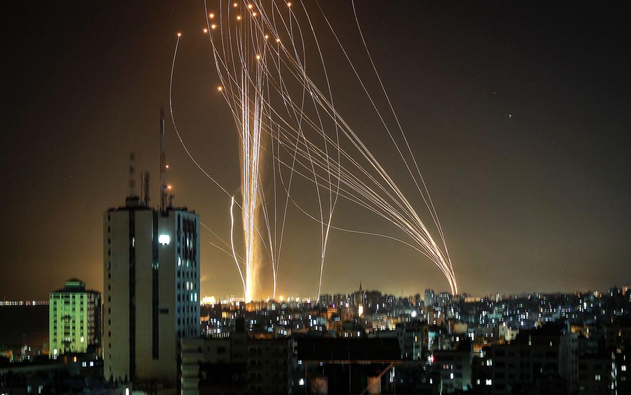 Streaks of light are seen as Israel's Iron Dome anti-missile system intercept rockets launched from the Gaza Strip towards Israel, as seen from Ashkelon - ANAS BABA Source: AFP/ANAS BABA Source: AFP