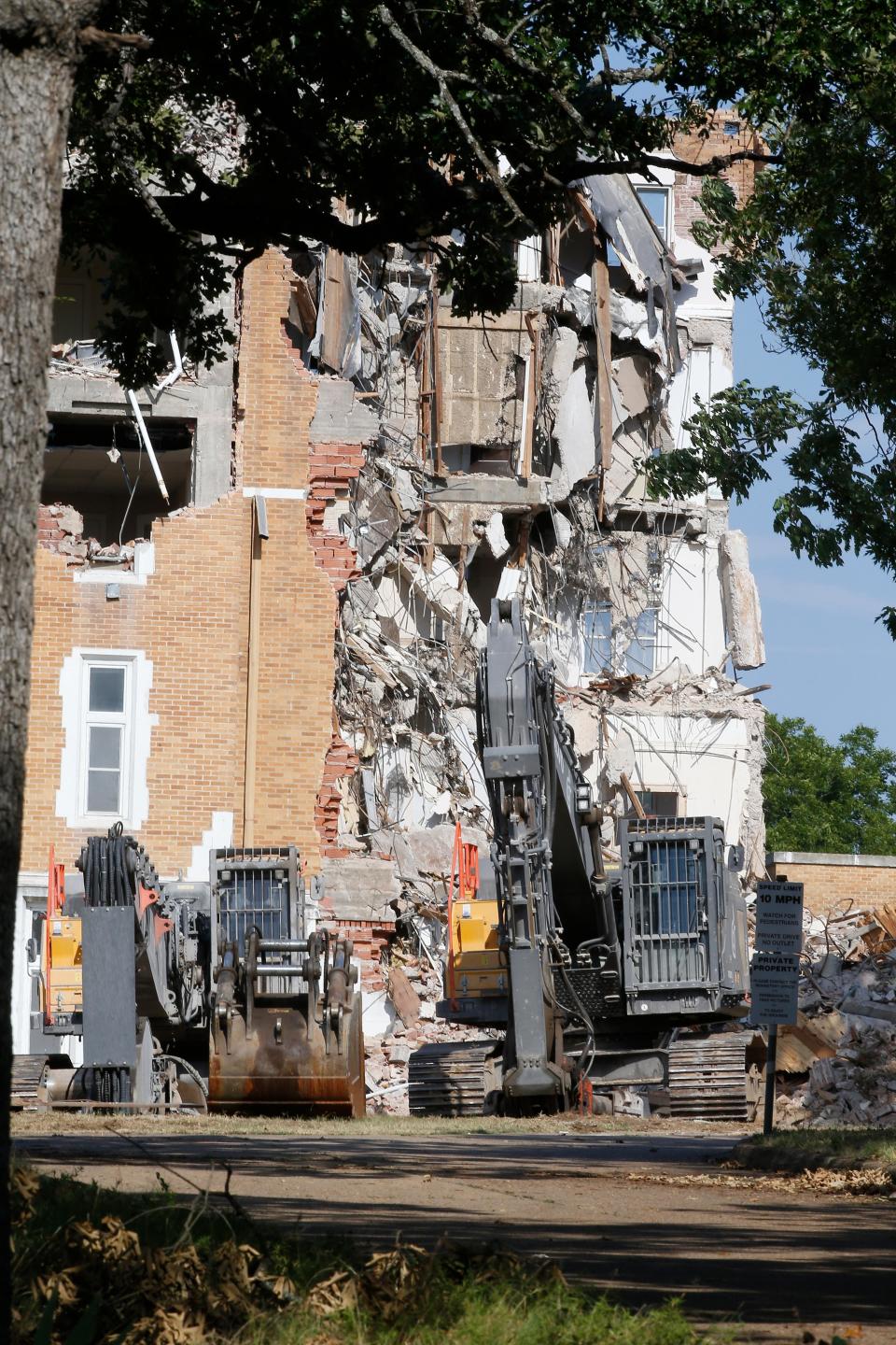 Crews began the demolition of the St. Scholastica Monastery, the former home of the Benedictine Sisters, on Monday after heavy equipment moved into the area.