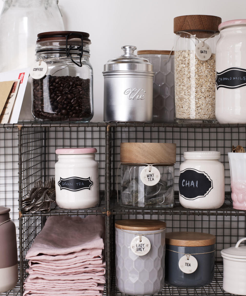 food jars with labels on metal wire shelving